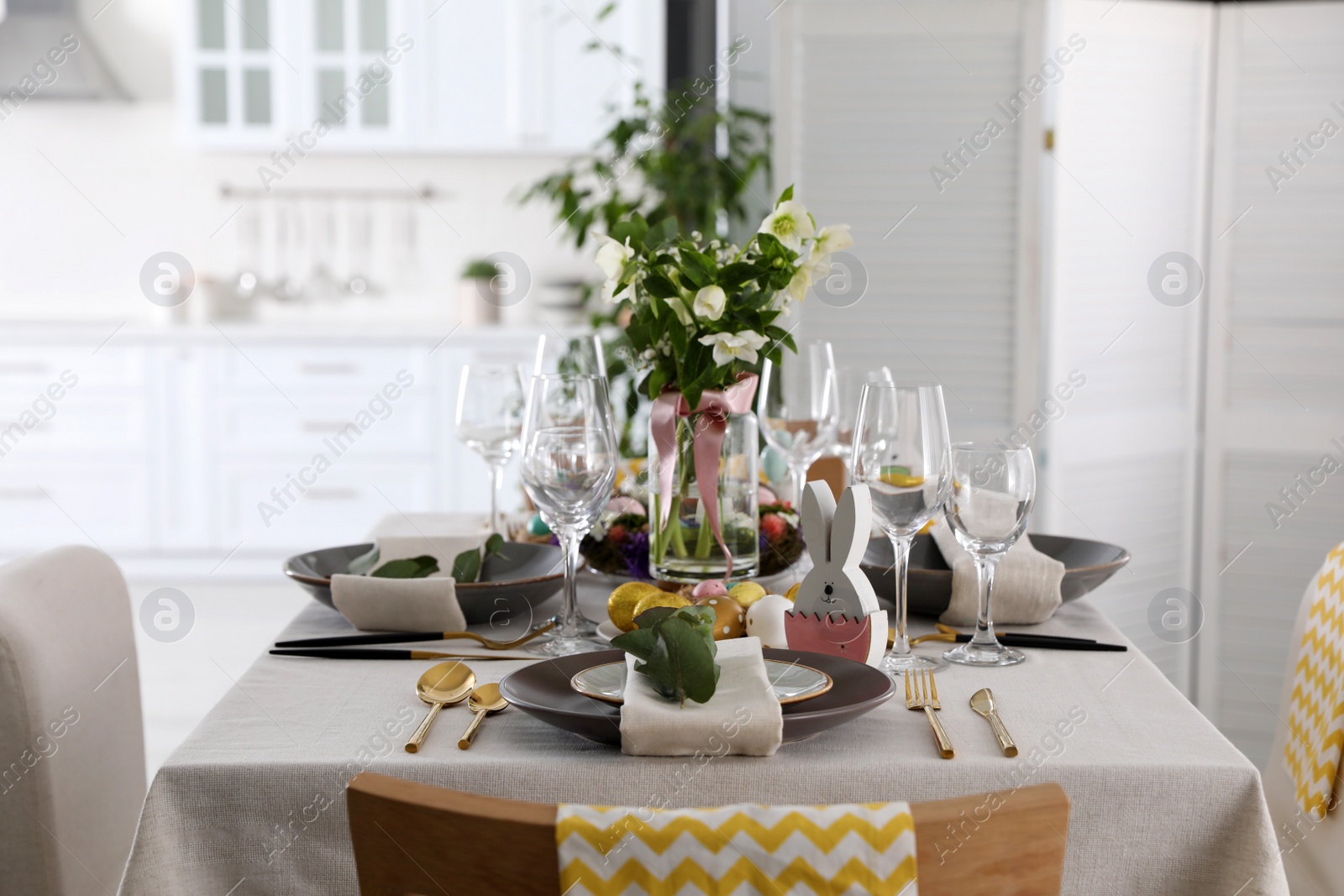 Photo of Beautiful Easter table setting with festive decor indoors