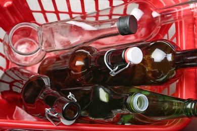 Photo of Crate with glass garbage, top view. Trash recycling