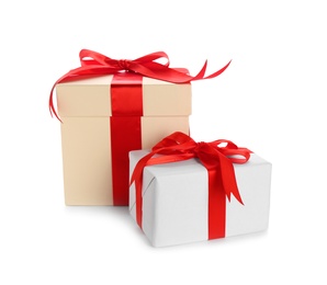 Different gift boxes with bows on white background