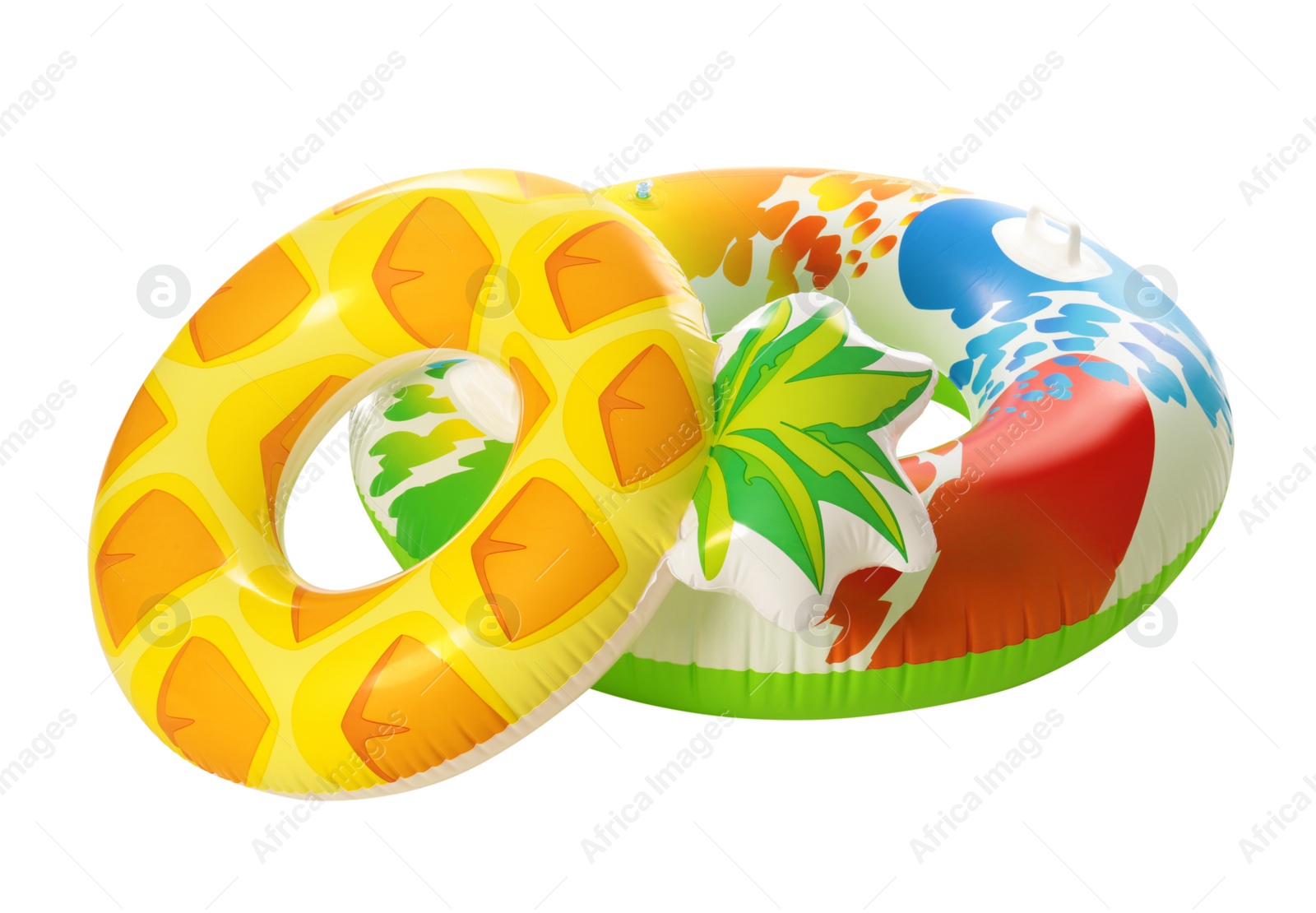 Photo of Different bright inflatable rings on white background. Summer holidays