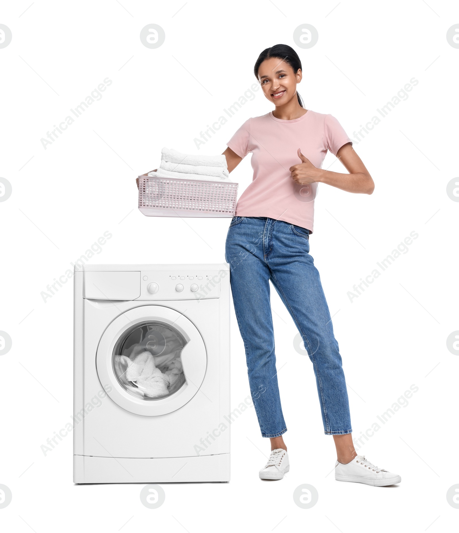 Photo of Beautiful woman with laundry basket near washing machine on white background