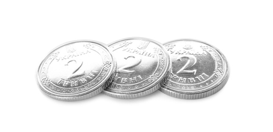 Photo of Ukrainian coins on white background. National currency