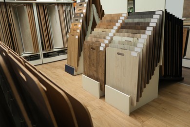 Photo of Many different samples of wooden flooring in store