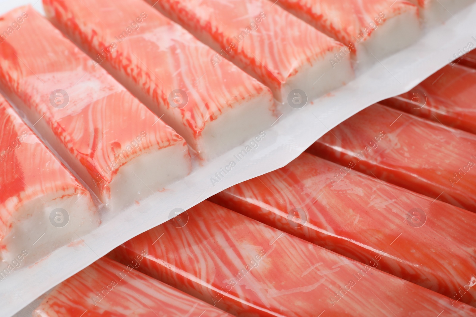 Photo of Closeup view on packs of fresh crab sticks