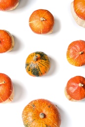 Photo of Flat lay composition with orange pumpkins on white background. Autumn holidays