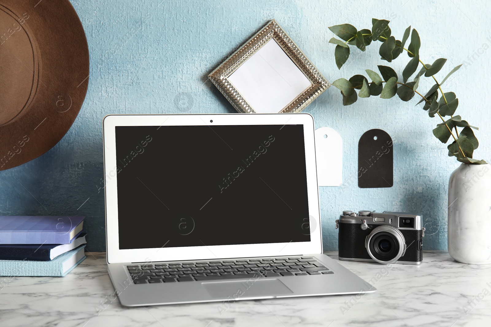 Photo of Cozy blogger workplace with laptop at home