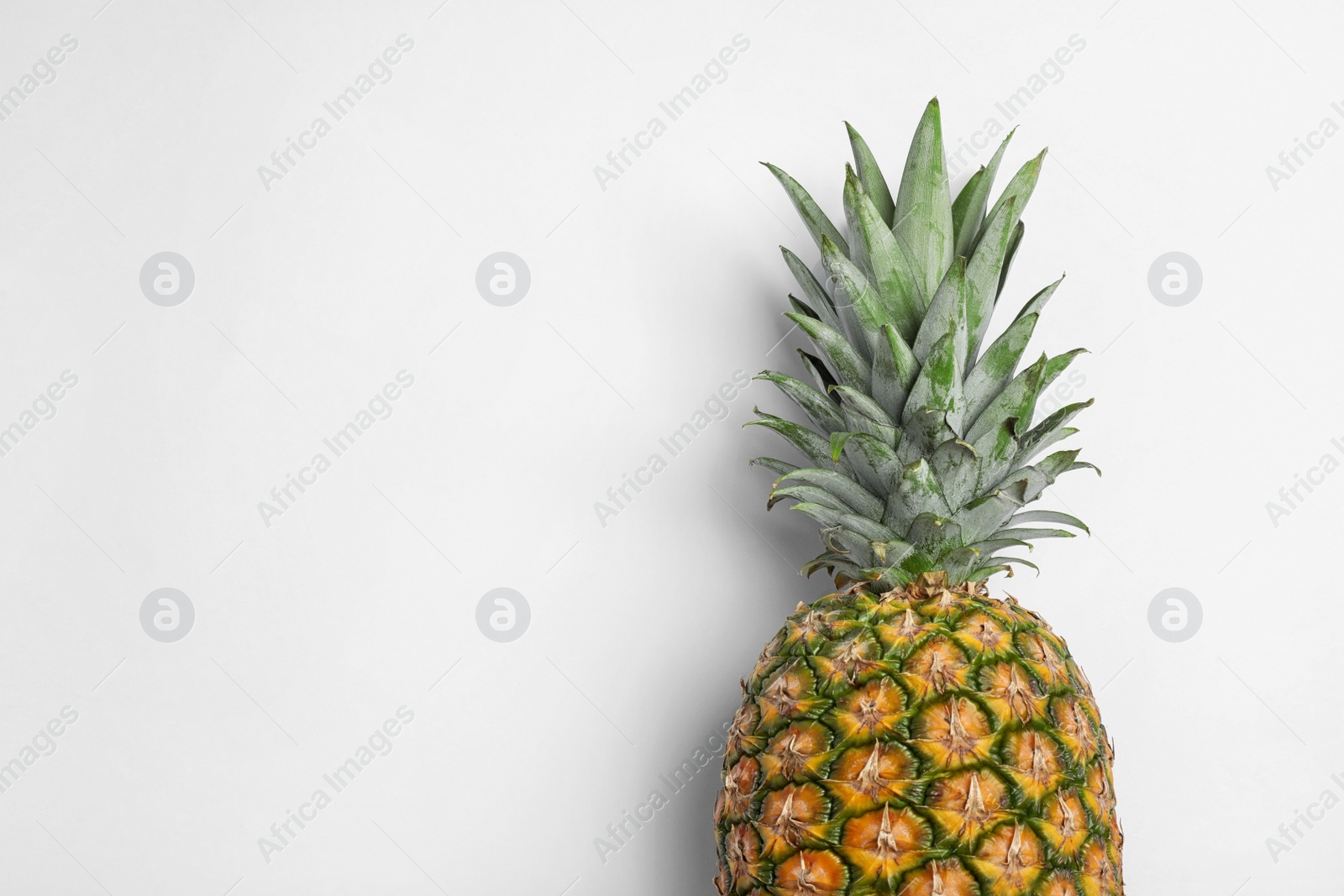 Photo of Tasty fresh raw pineapple on white background, top view