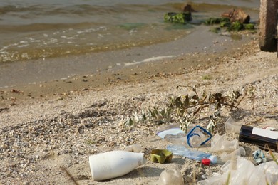 Photo of Garbage scattered on beach. Environment pollution problem