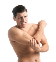 Young man suffering from pain in elbow on white background