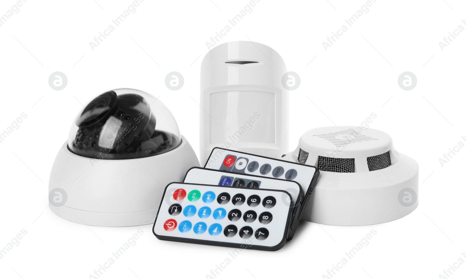 Photo of CCTV camera, remote controls, smoke and movement detectors on white background. Home security system