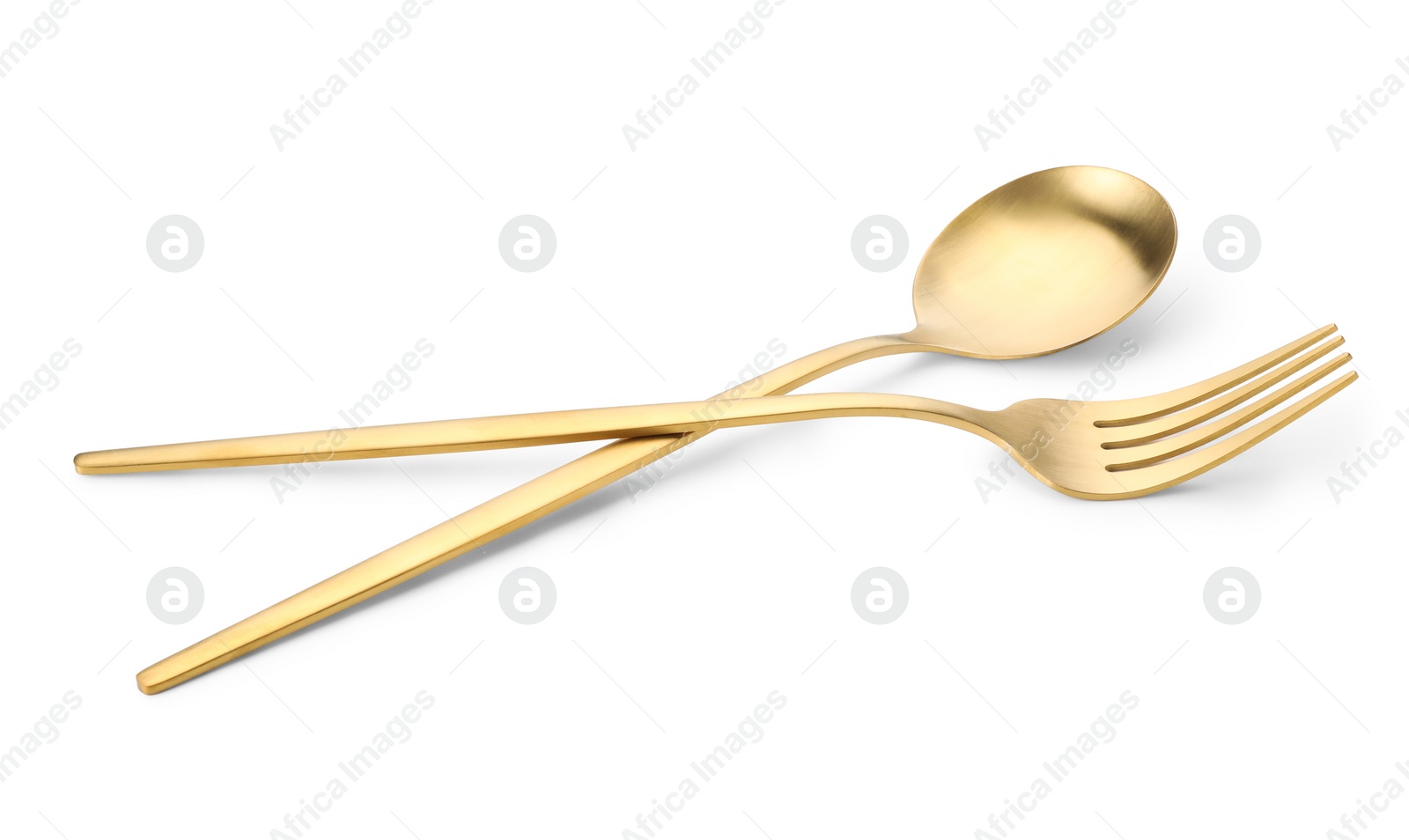 Photo of Shiny golden fork and spoon isolated on white. Luxury cutlery