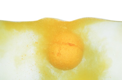 Photo of Bath bomb in water on white background