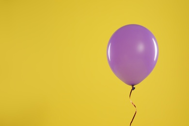 Photo of Bright balloon on color background, space for text. Celebration time