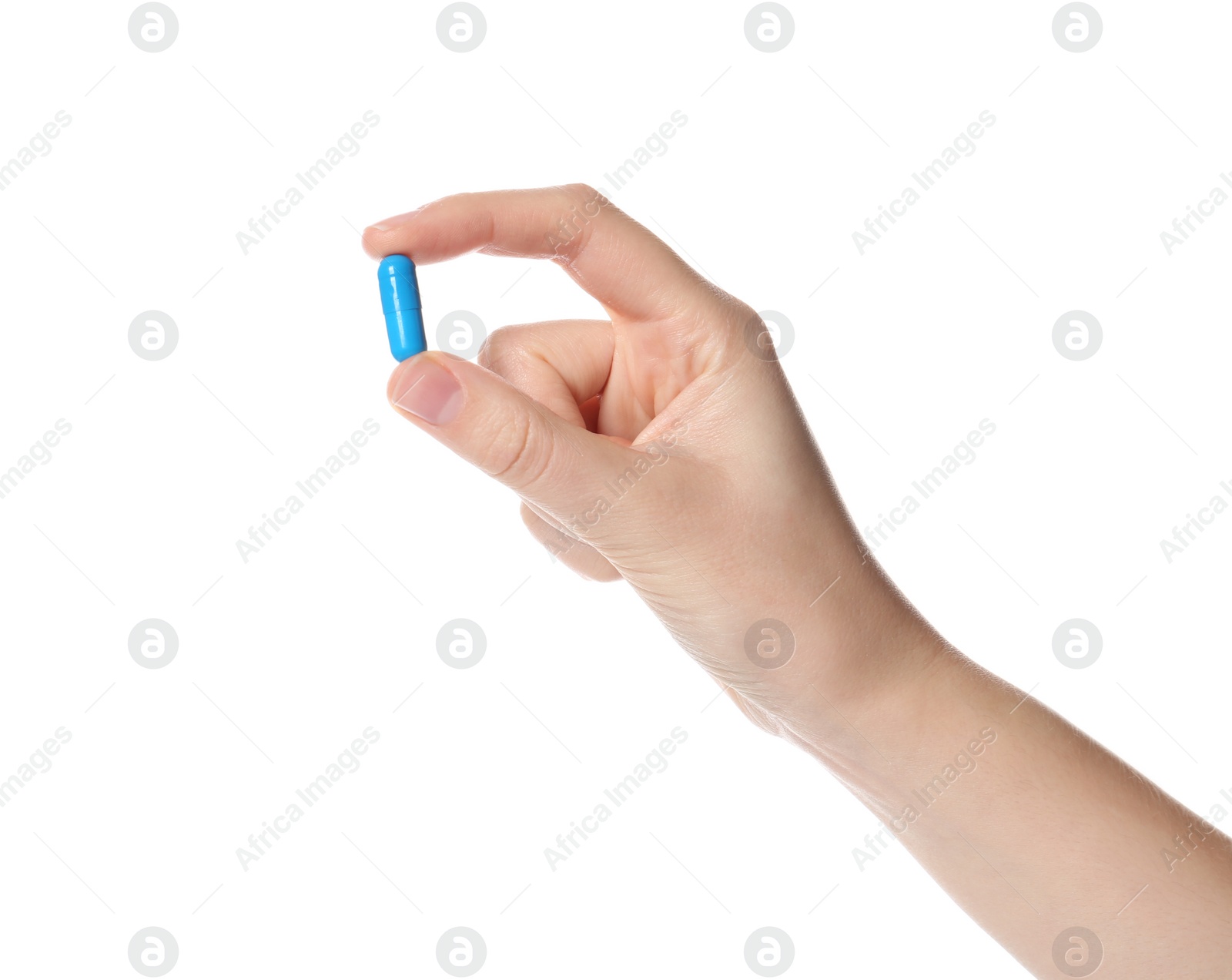 Photo of Woman holding color pill on white background, closeup