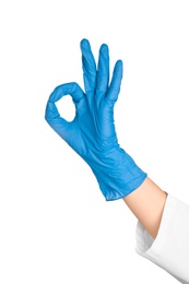 Photo of Doctor in medical glove showing OK gesture on white background