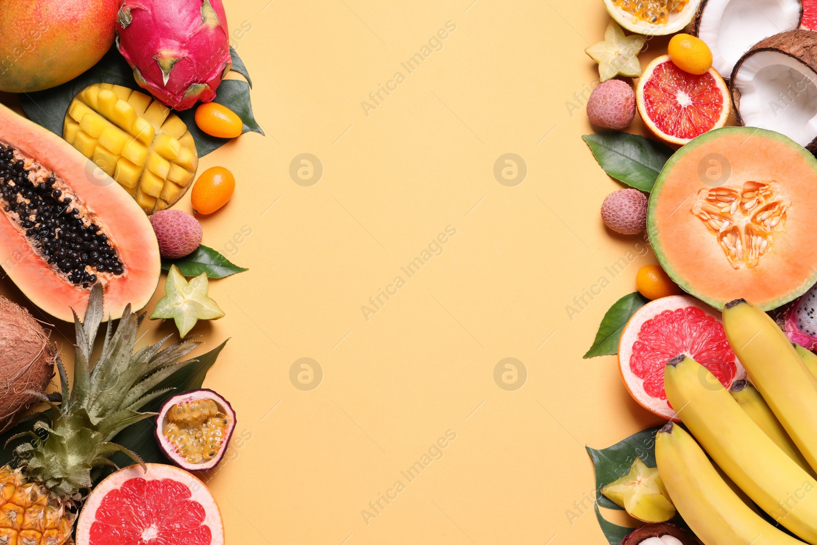 Photo of Different exotic fruits on beige background, flat lay. Space for text