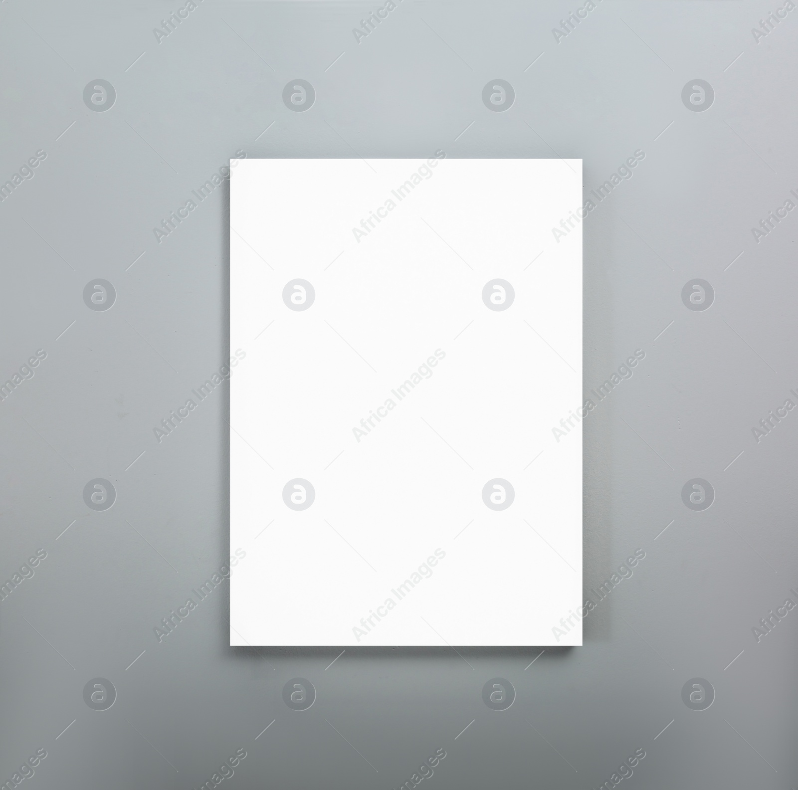 Image of Blank poster on grey wall. Mockup for design 