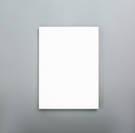 Image of Blank poster on grey wall. Mockup for design 