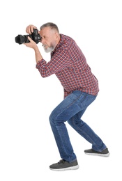 Photo of Mature male photographer with camera on white background