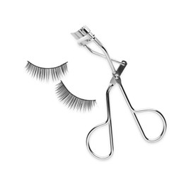 Photo of False eyelashes and curler on white background, top view