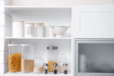 Photo of Products and houseware on shelves in kitchen