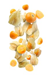 Ripe orange physalis fruits with calyx falling on white background