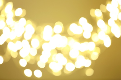 Photo of Beautiful golden lights as background. Bokeh effect