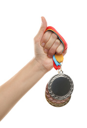 Woman holding medals on white background, closeup. Space for design