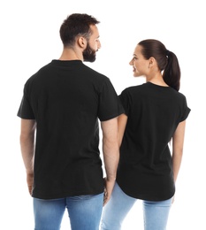 Young couple in t-shirts on white background. Mockup for design