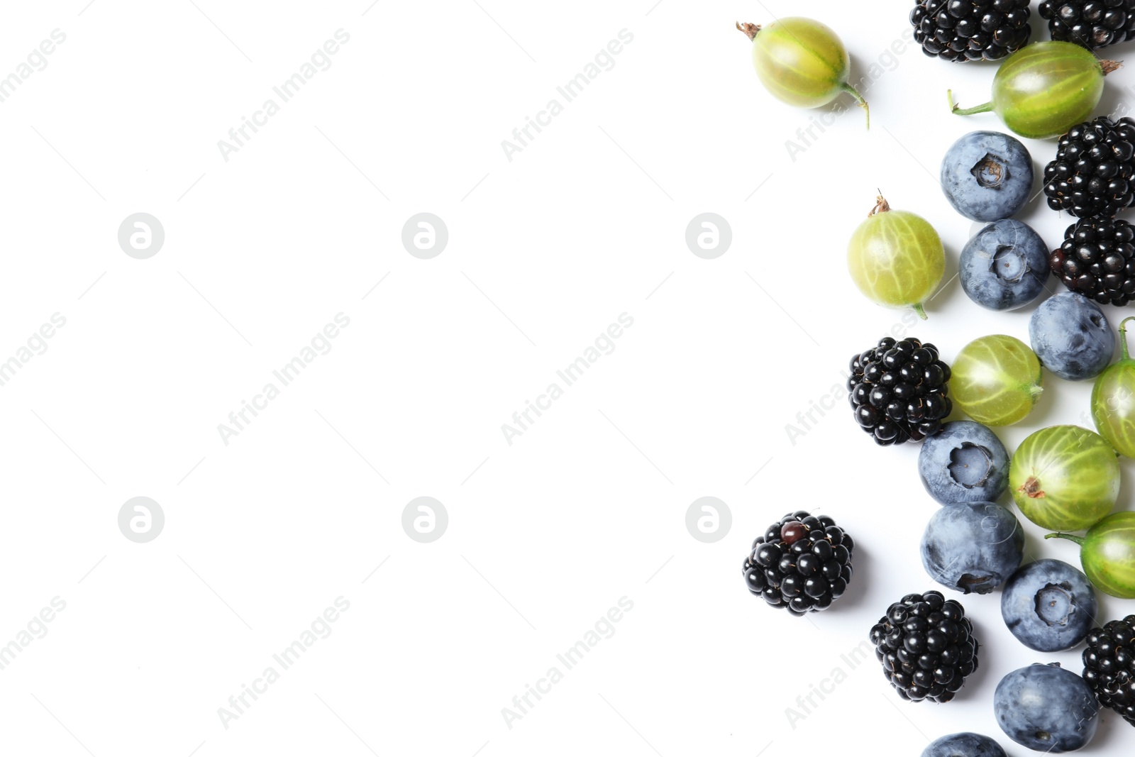 Photo of Gooseberries, blackberries and blueberries on white background