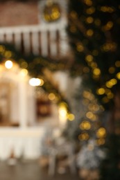 Blurred view of stylish room interior with Christmas tree and festive decor