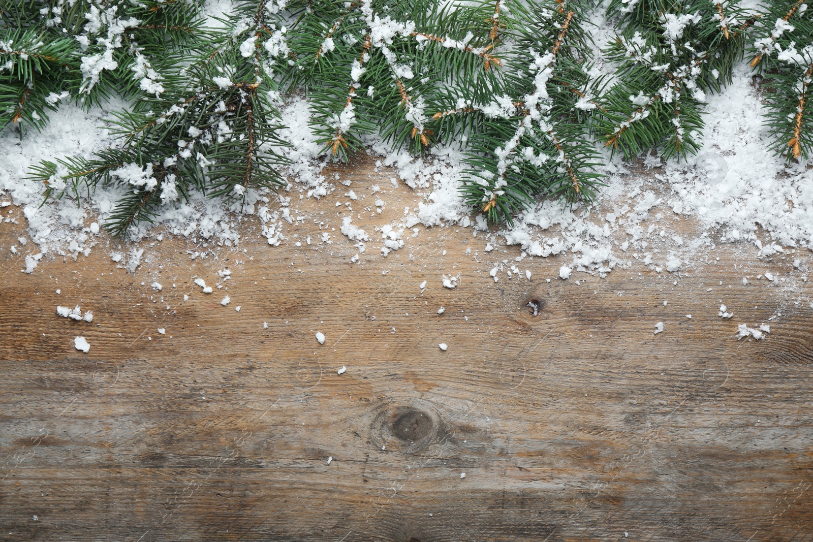 Photo of Flat lay composition with Christmas decorations on wooden background, space for text. Winter season