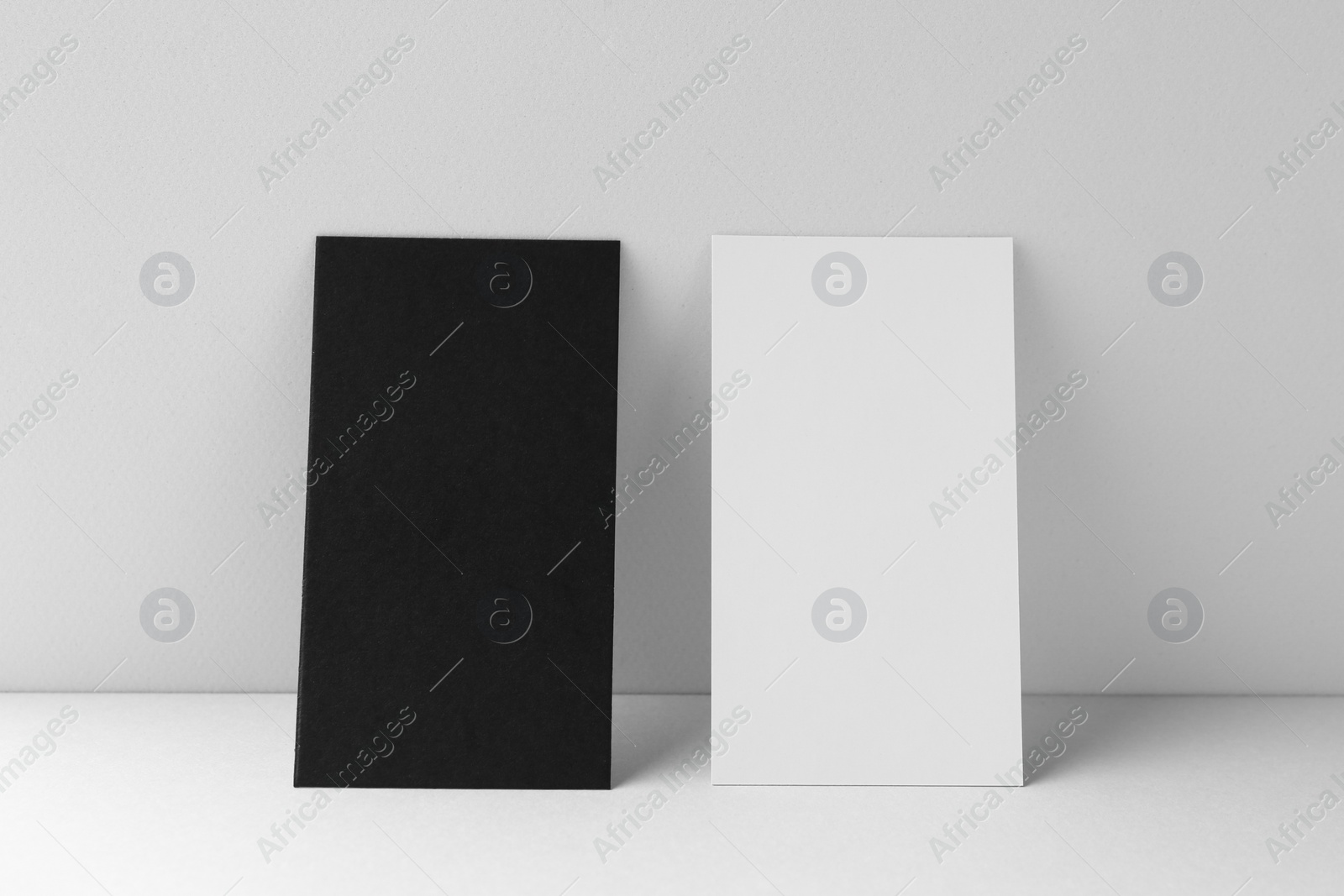 Photo of Blank business cards on white background. Mockup for design