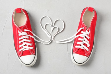 Pair of stylish shoes with laces on light grey background, flat lay