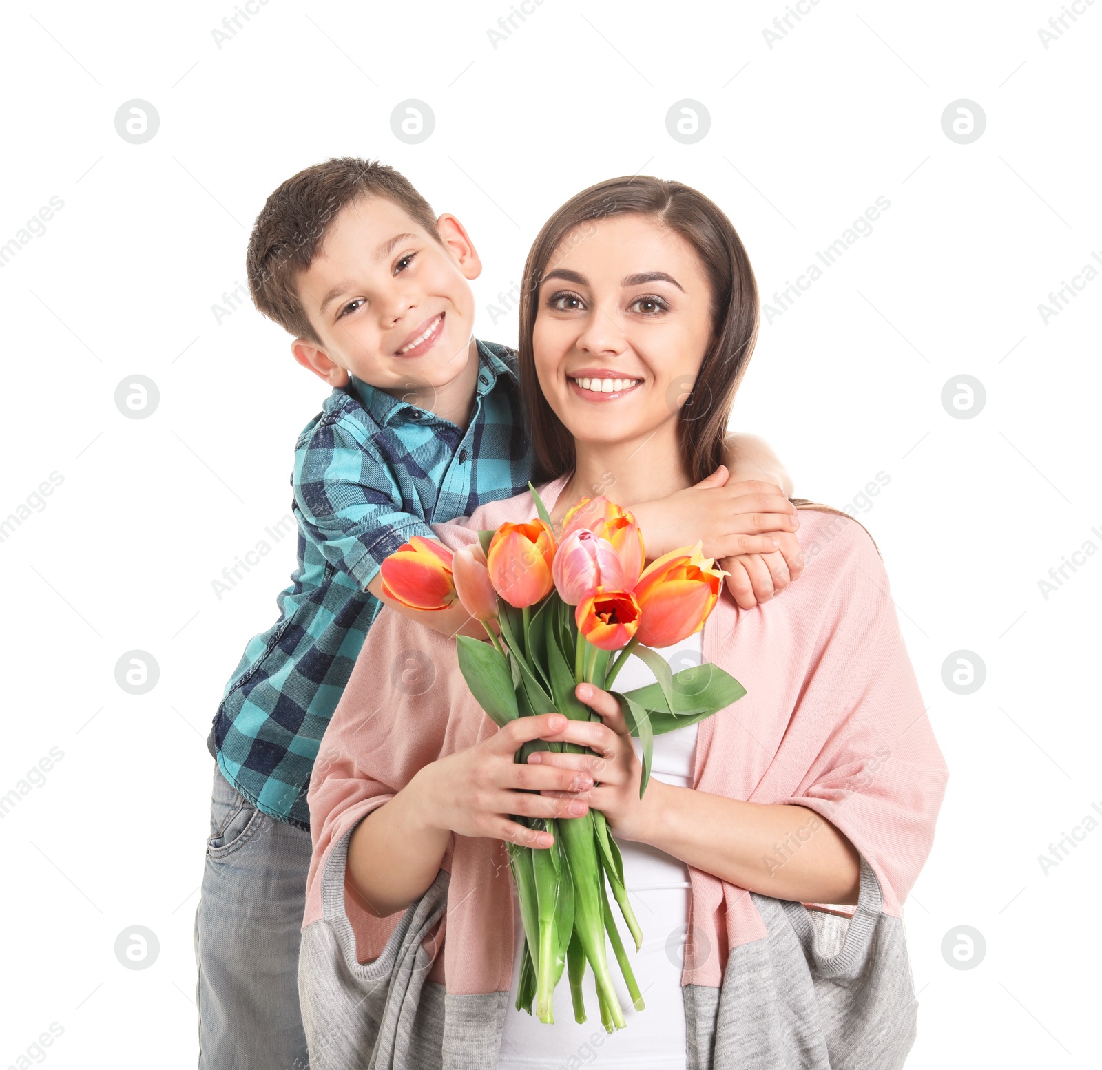 Photo of Portrait of happy woman with flowers and her son on white background. Mother's day celebration