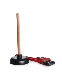 Plunger with wooden handle and pipe wrench on white background