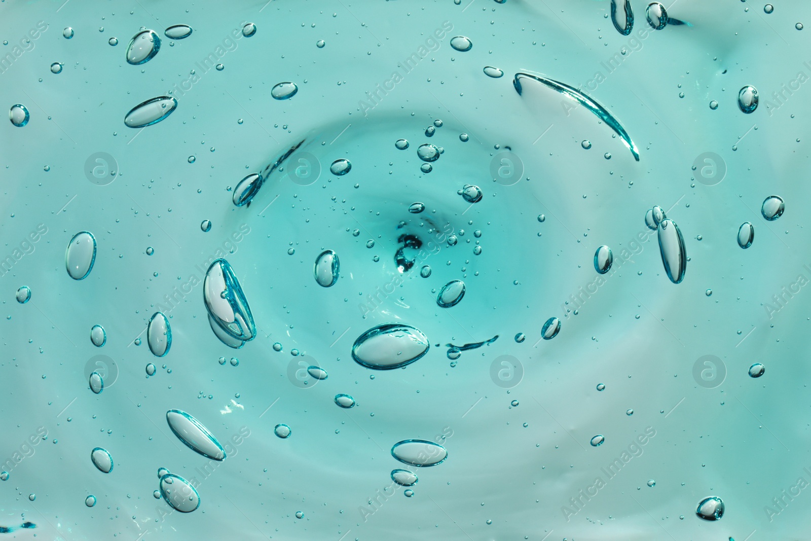 Photo of Turquoise facial gel as background, closeup view