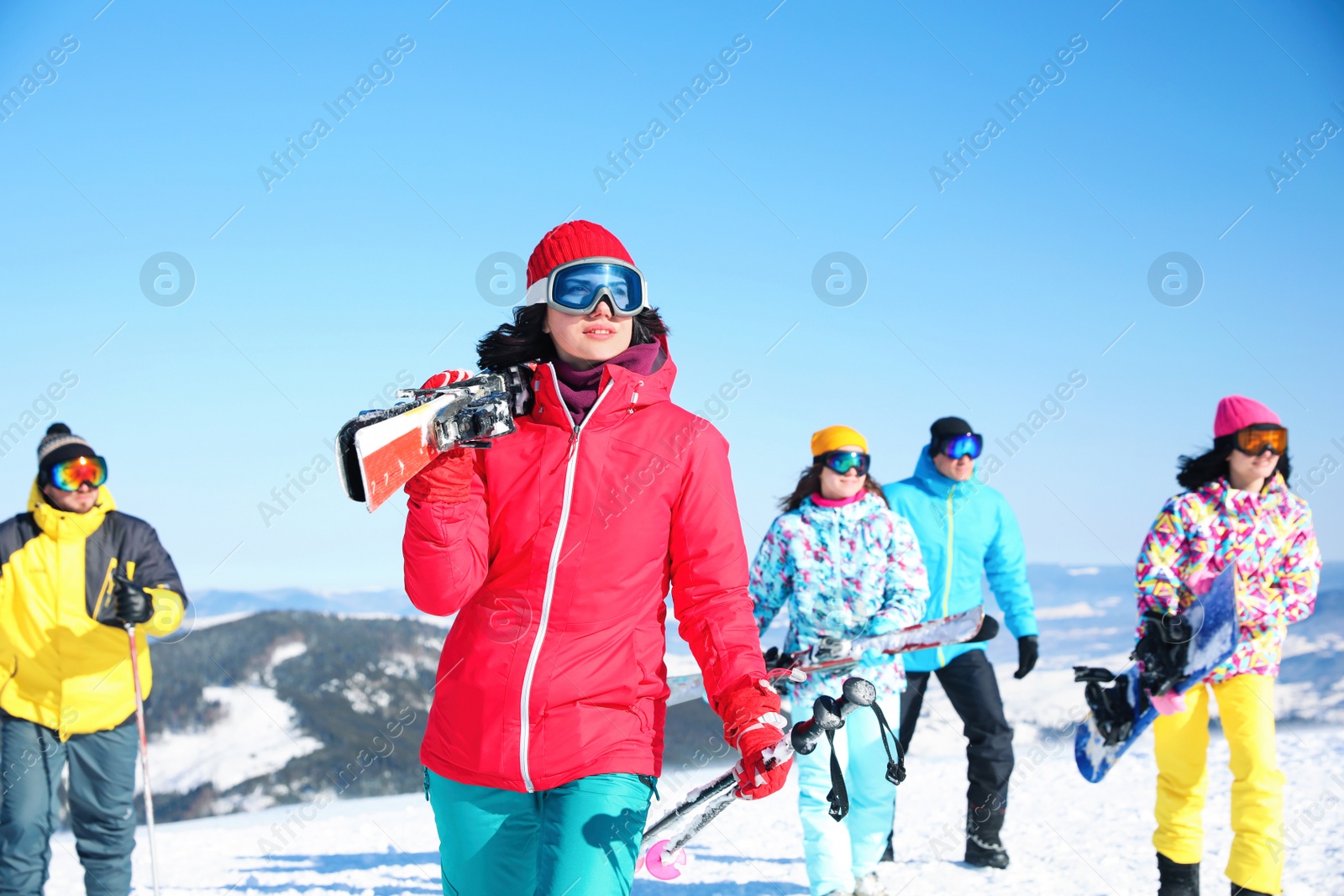 Photo of Young woman with ski at resort. Winter vacation