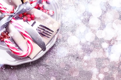 Image of Beautiful Christmas table setting on grey background, top view. Space for text