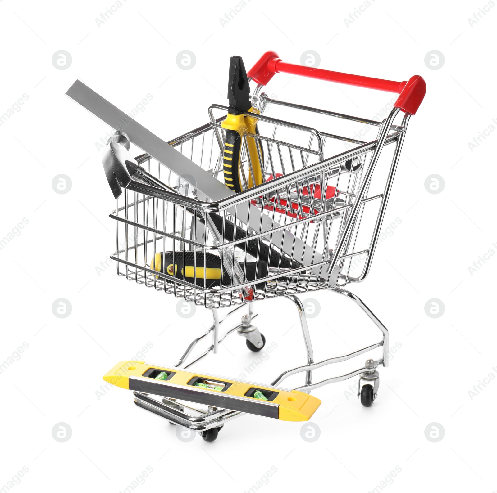 Photo of Small shopping cart with set of construction tools isolated on white