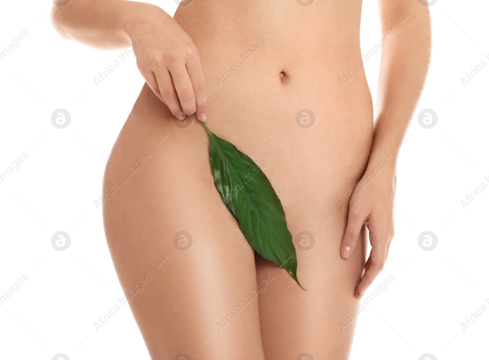 Photo of Woman with smooth skin holding leaf on white background, closeup. Brazilian bikini epilation