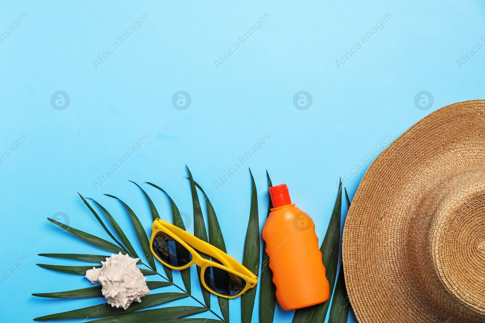 Photo of Flat lay composition with collection of beach objects on color background