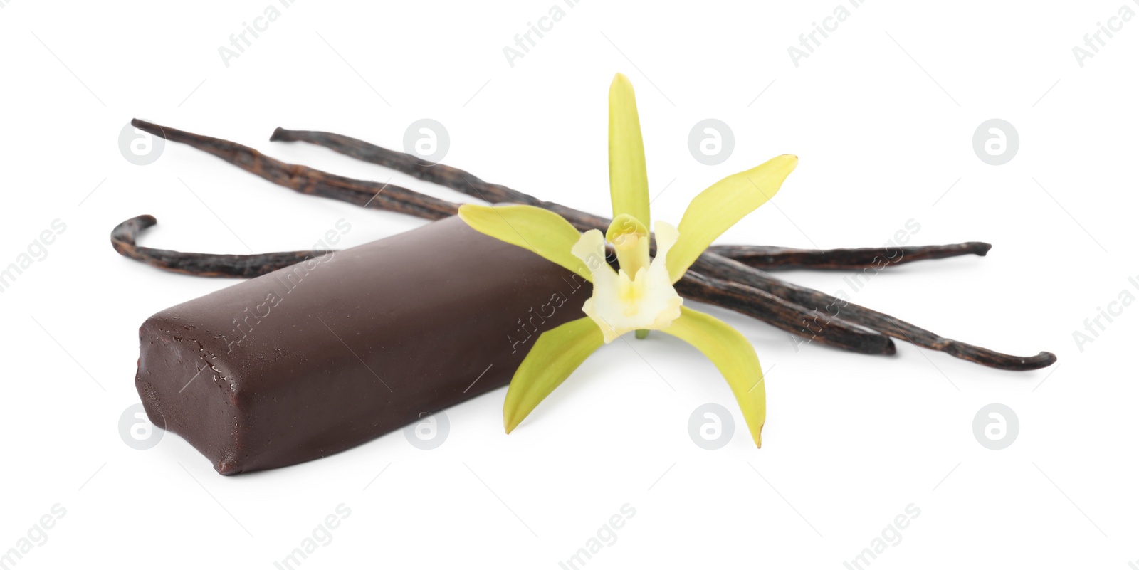 Photo of Glazed curd cheese bar, vanilla pods and flower isolated on white