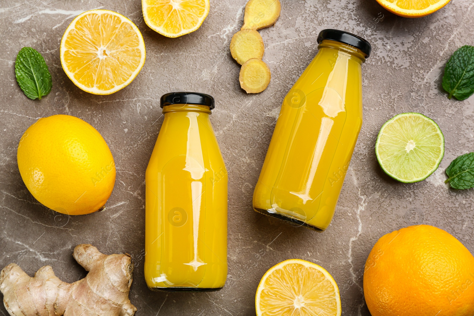 Photo of Flat lay composition with immunity boosting drink and ingredients on grey table