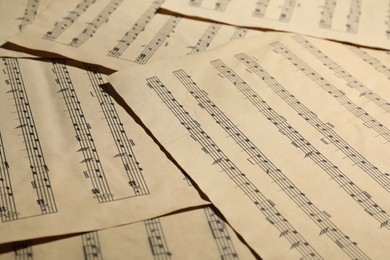 Photo of Many old note sheets as background, closeup