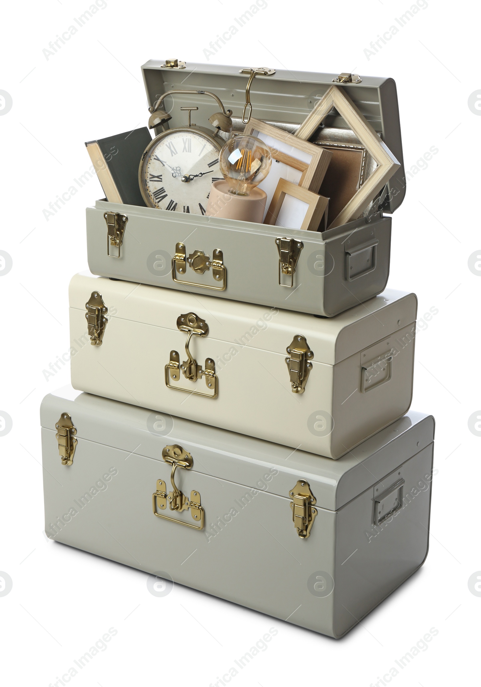 Photo of Stylish storage trunks with different interior elements on white background