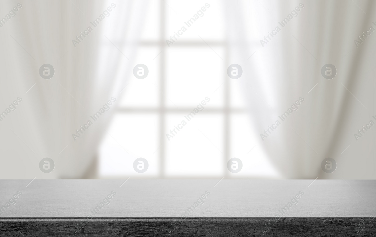 Image of Empty grey stone surface and blurred view of modern window 