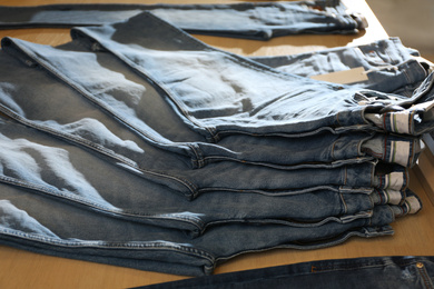 Photo of Stylish blue jeans on display in shop