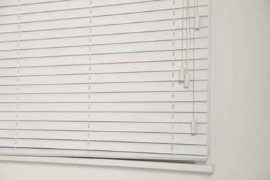 Photo of Window with closed blinds in room, closeup