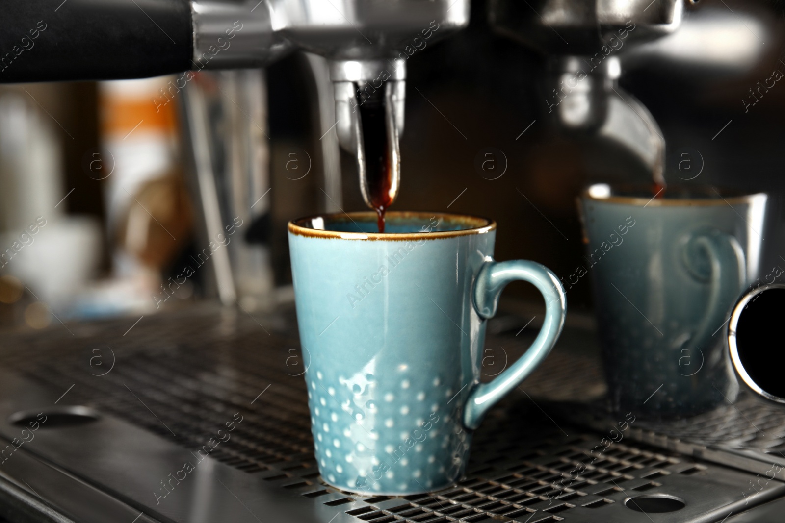 Photo of Making fresh aromatic espresso using professional coffee machine